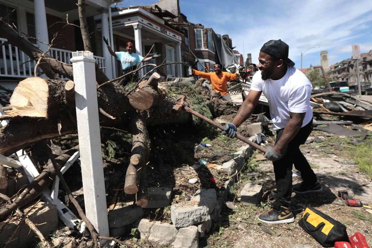 Curbside debris and damaged household items staged for post-storm removal.